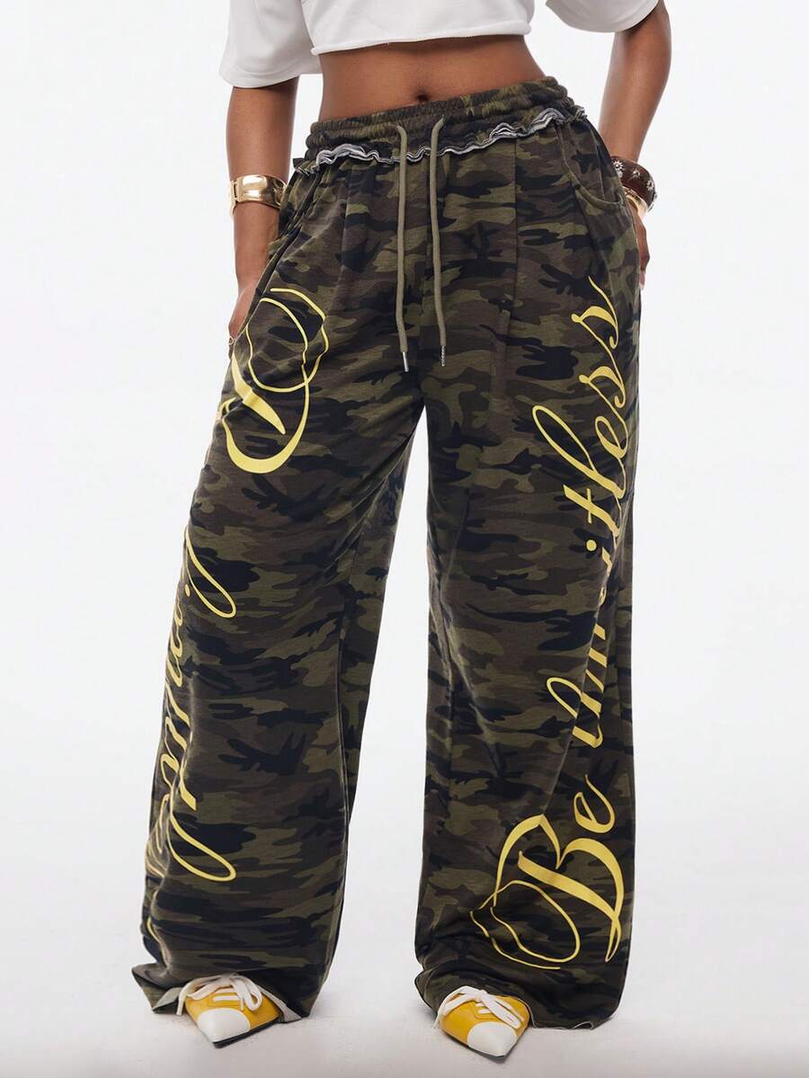Women's casual straight leg baggy lounge pants in light grey with an adjustable drawstring waist and side pockets.