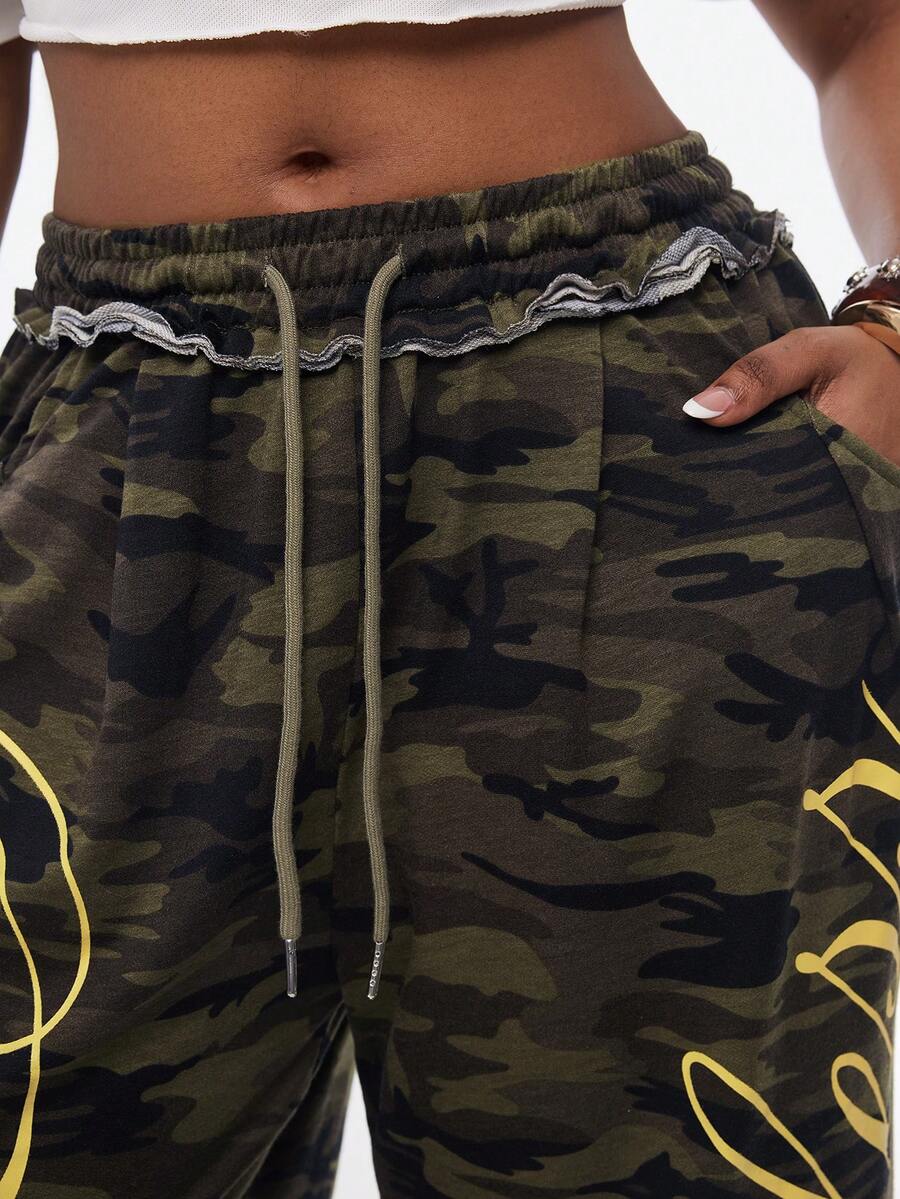 Women's casual straight leg baggy lounge pants in light grey with an adjustable drawstring waist and side pockets.