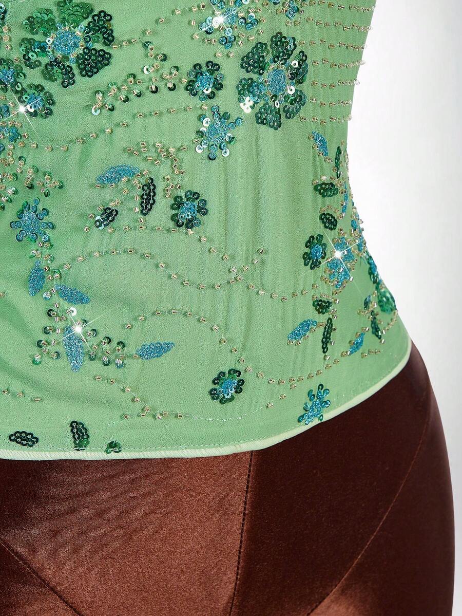 Women's embroidered sequin halter cami top featuring a deep V-neck, backless party design, and slim fit silhouette.