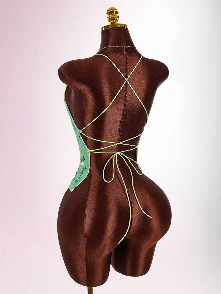 Women's embroidered sequin halter cami top featuring a deep V-neck, backless party design, and slim fit silhouette.