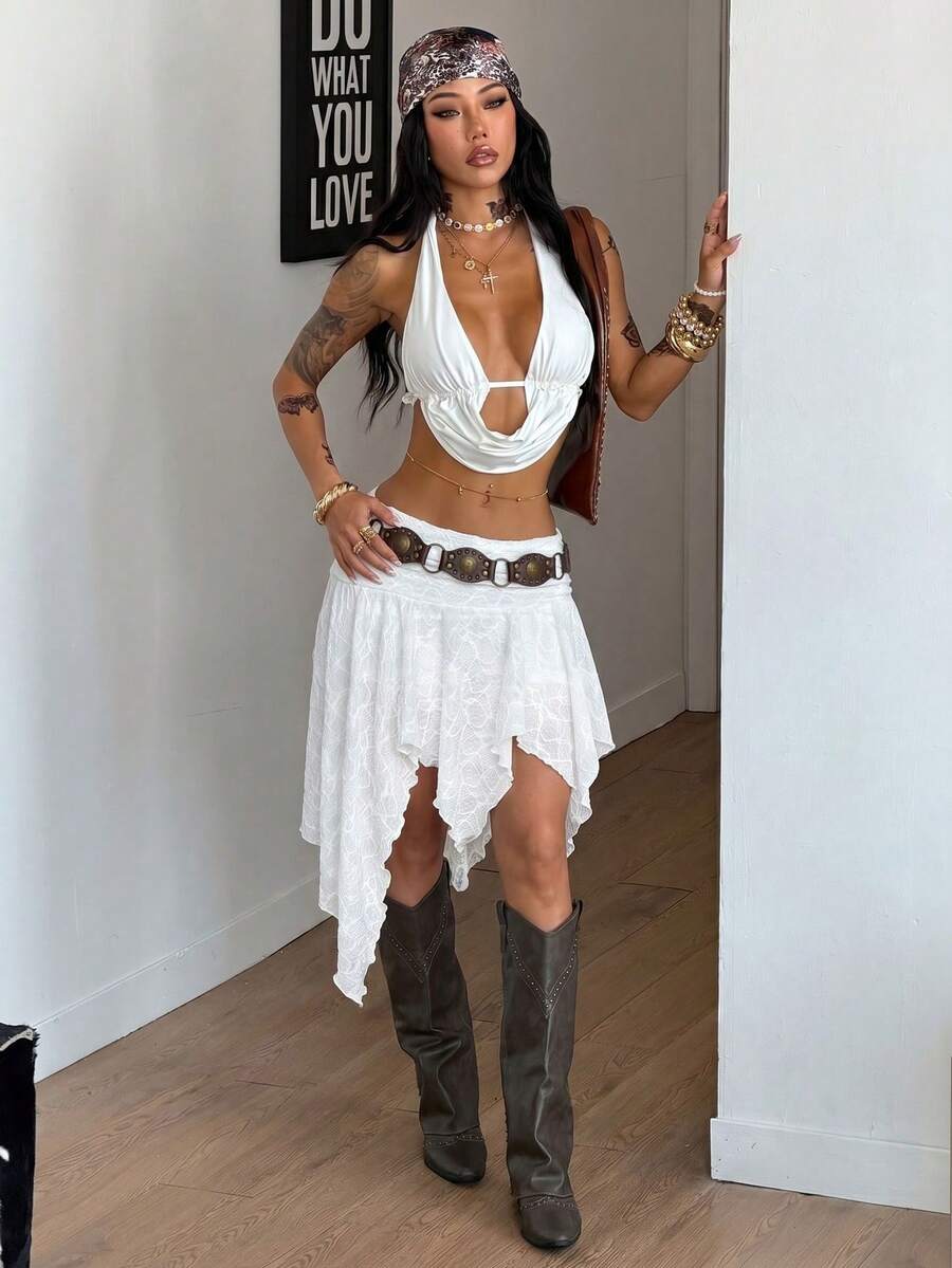 Women's floral lace mini skirt in white with asymmetrical ruffle trim and low waist design.