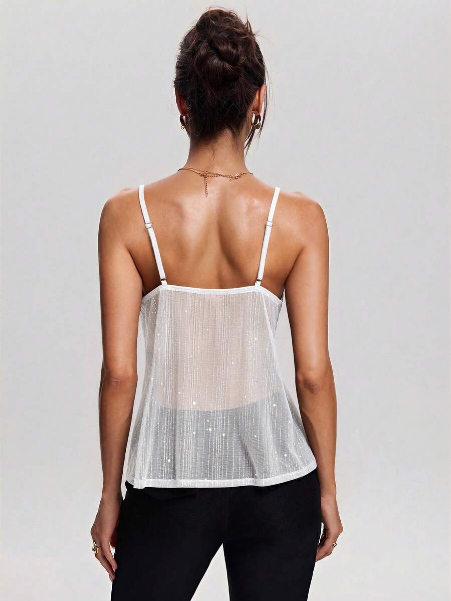 Women's backless spaghetti strap camisole top featuring contrast lace details, knot accents, and a slim fit.