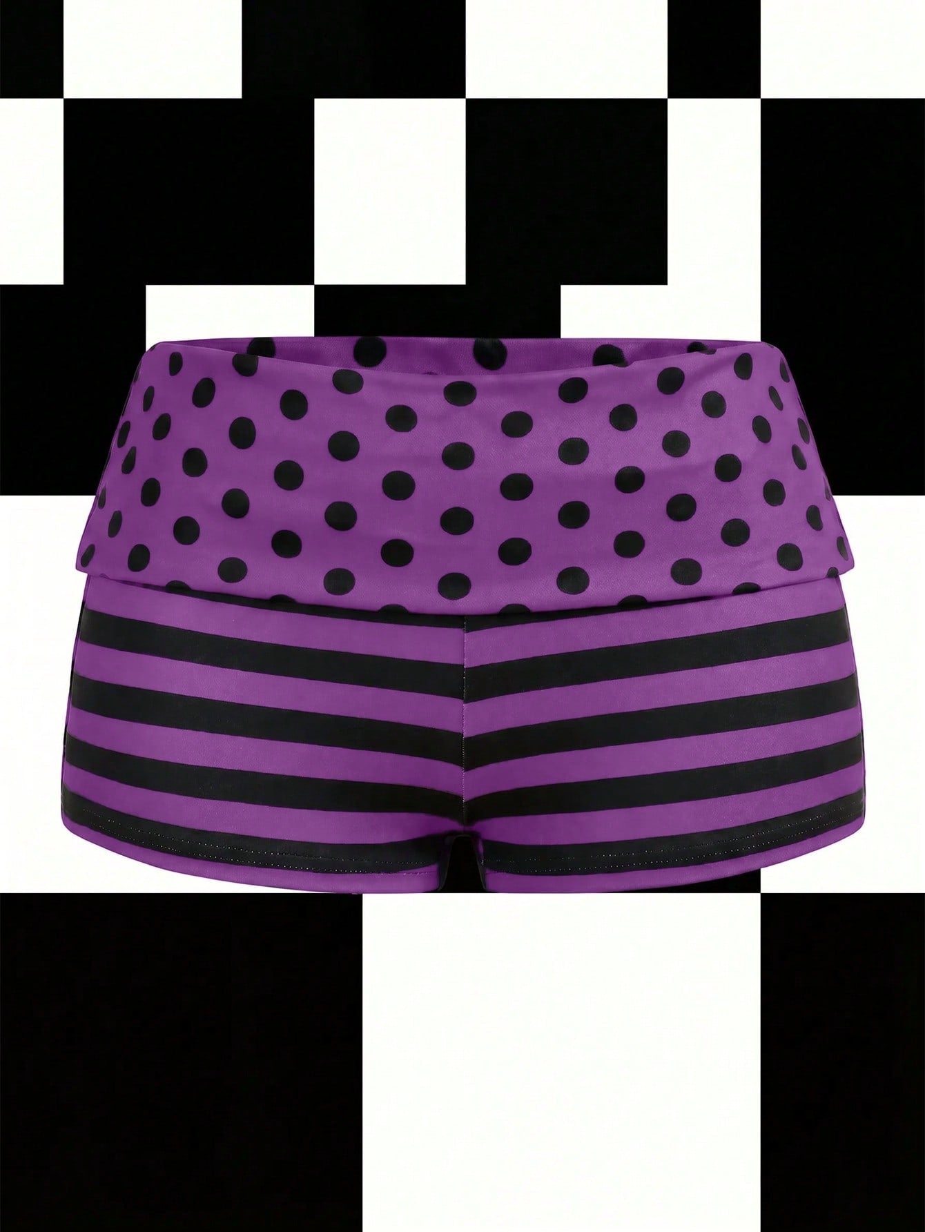 Women's black low waist mini track shorts with contrast polka dot, striped, geometric, and plant-inspired print details, elastic waistband, and skinny fit