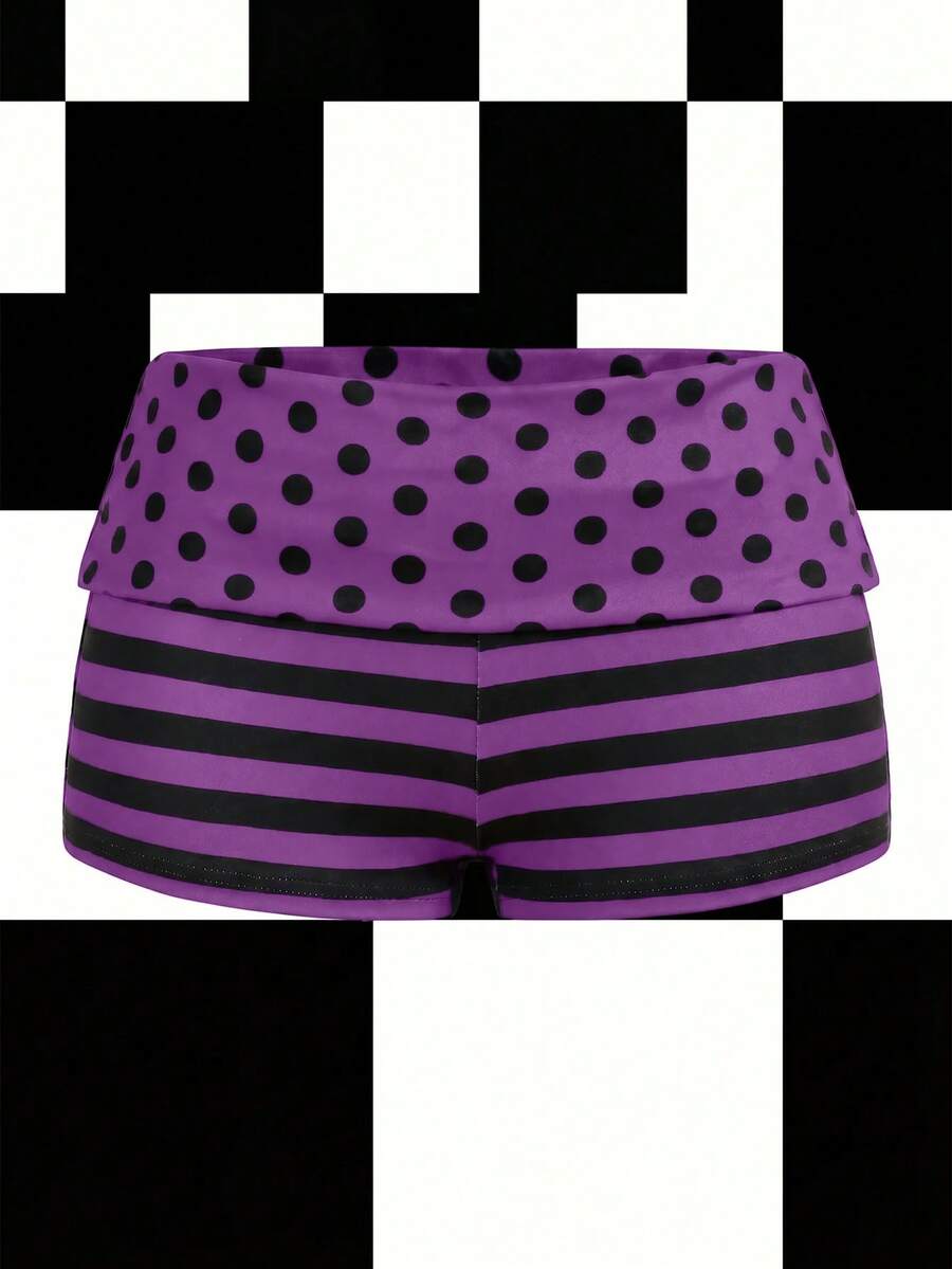 Women's black low waist mini track shorts with contrast polka dot, striped, geometric, and plant-inspired print details, elastic waistband, and skinny fit