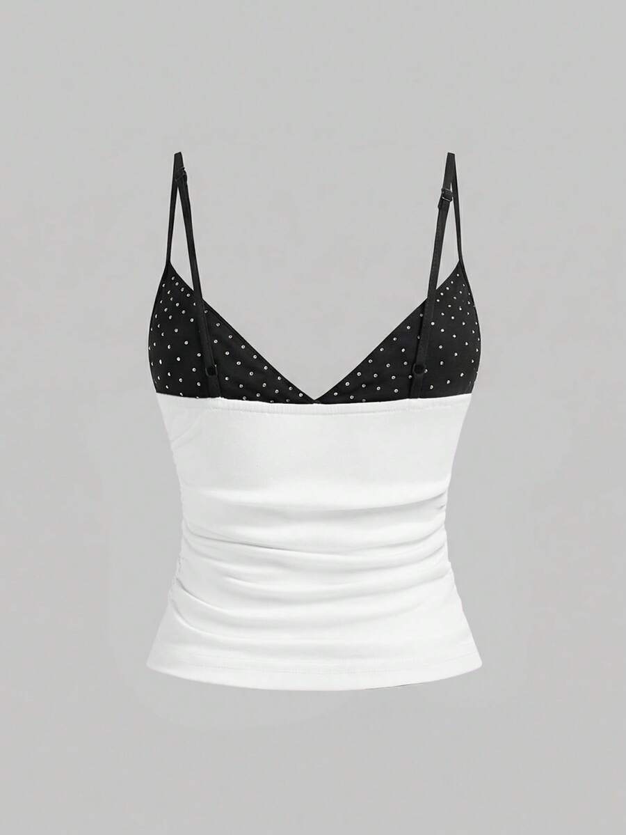 Women's slim fit sleeveless crop top featuring spaghetti straps, ruched detailing, and studded rhinestone accents.