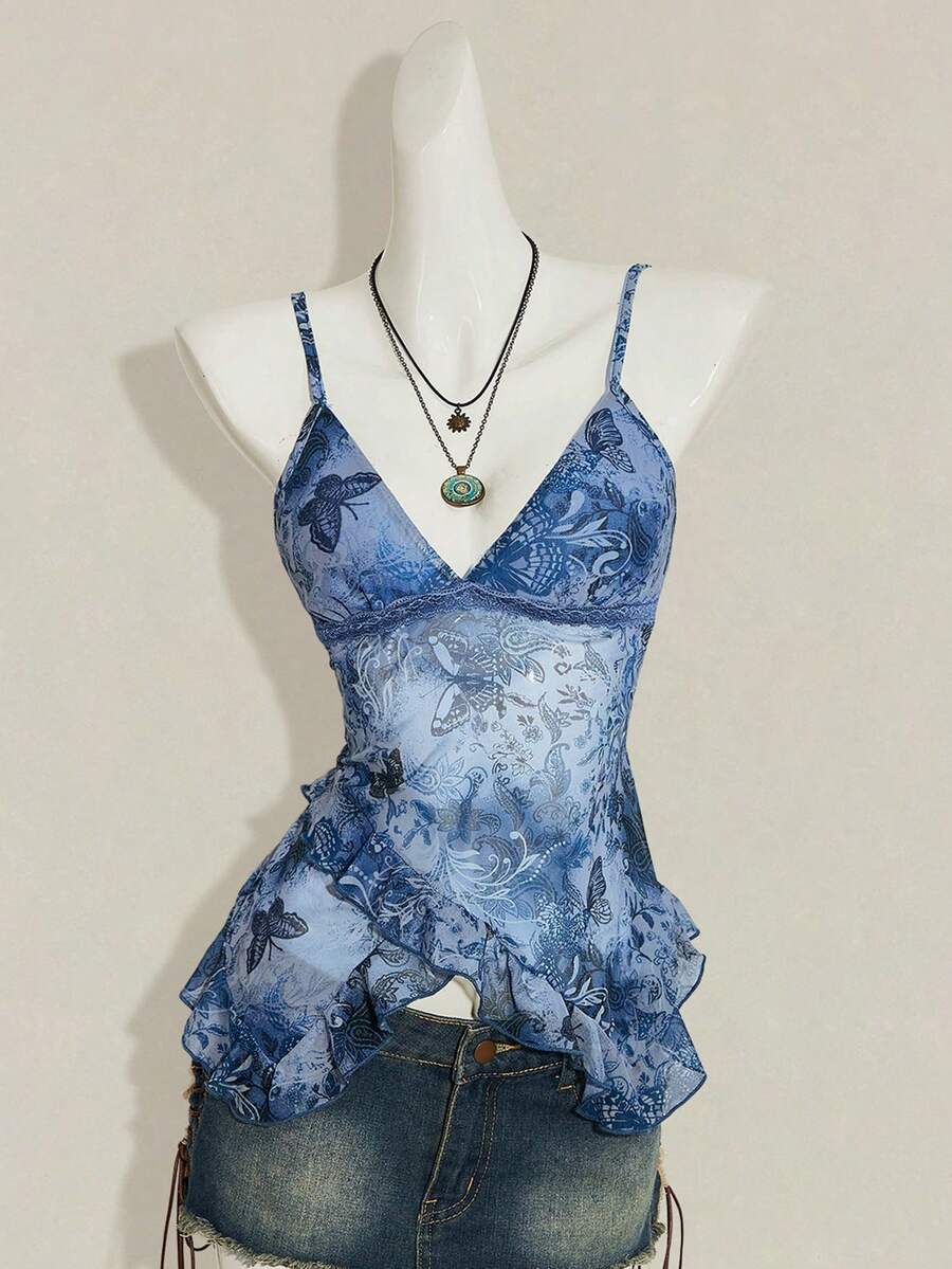 Women's graphic print camisole top featuring thin spaghetti straps, a backless cut, and an asymmetrical hem.