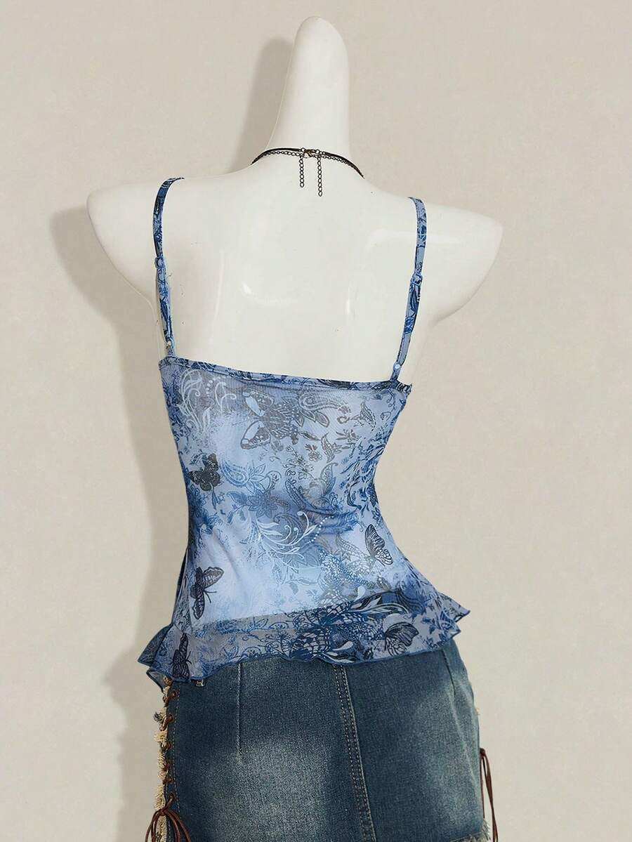 Women's graphic print camisole top featuring thin spaghetti straps, a backless cut, and an asymmetrical hem.