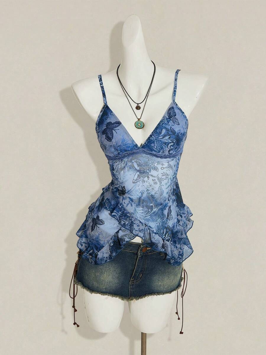 Women's graphic print camisole top featuring thin spaghetti straps, a backless cut, and an asymmetrical hem.