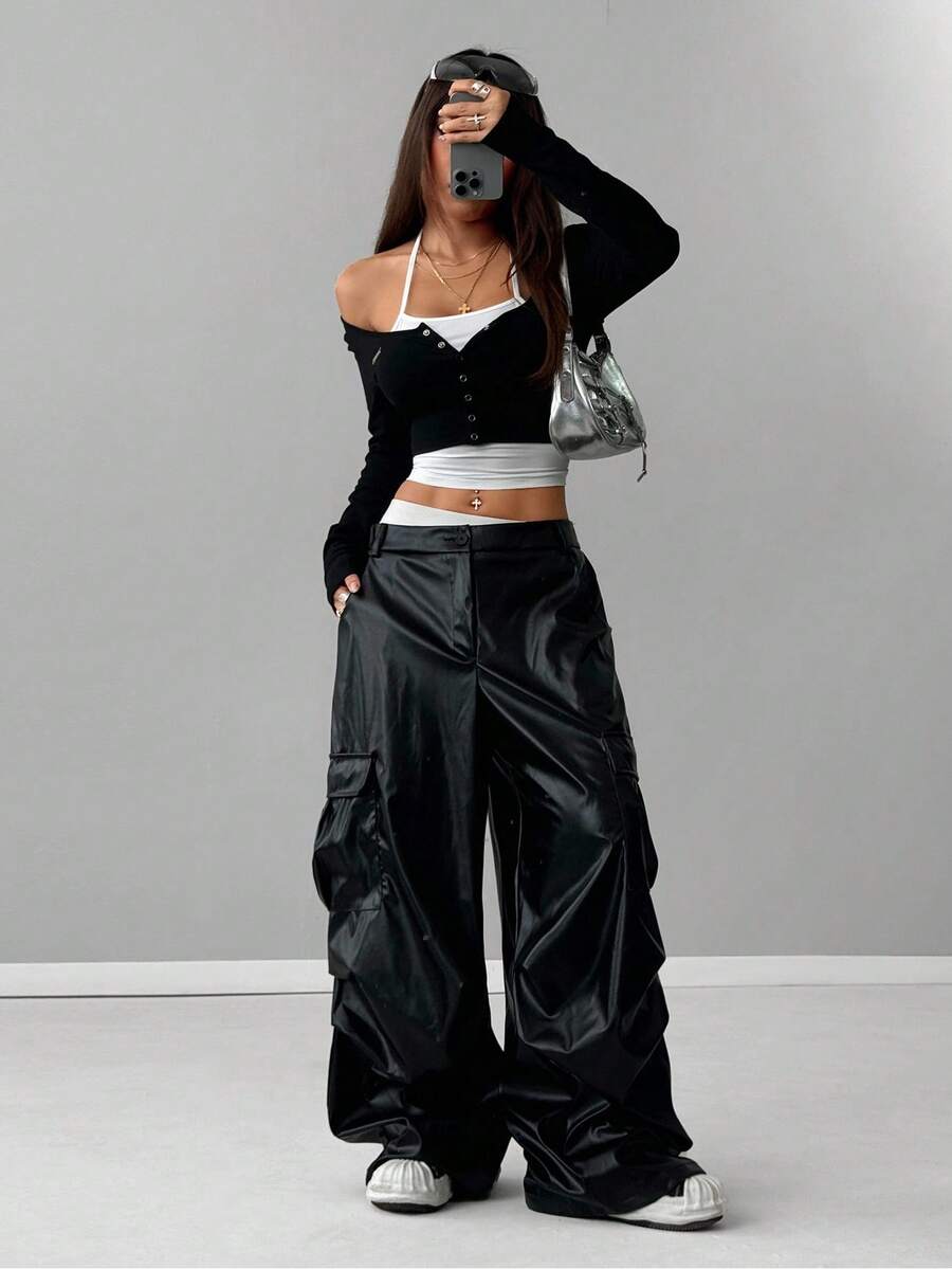 Women's black and white cropped Y2K-style top with lace-up camisole look, halter neckline, long sleeves, button front, rib-knit texture, and slim fit