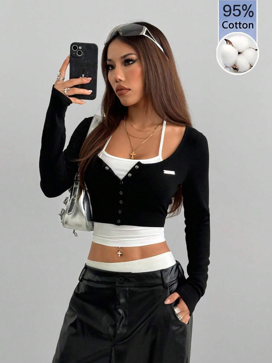 Women's black and white cropped Y2K-style top with lace-up camisole look, halter neckline, long sleeves, button front, rib-knit texture, and slim fit