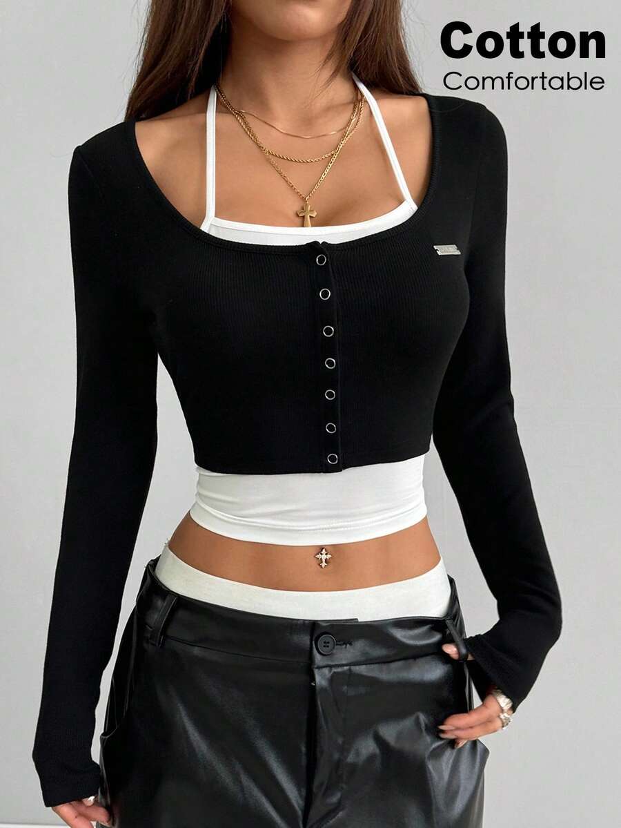Women's black and white cropped Y2K-style top with lace-up camisole look, halter neckline, long sleeves, button front, rib-knit texture, and slim fit