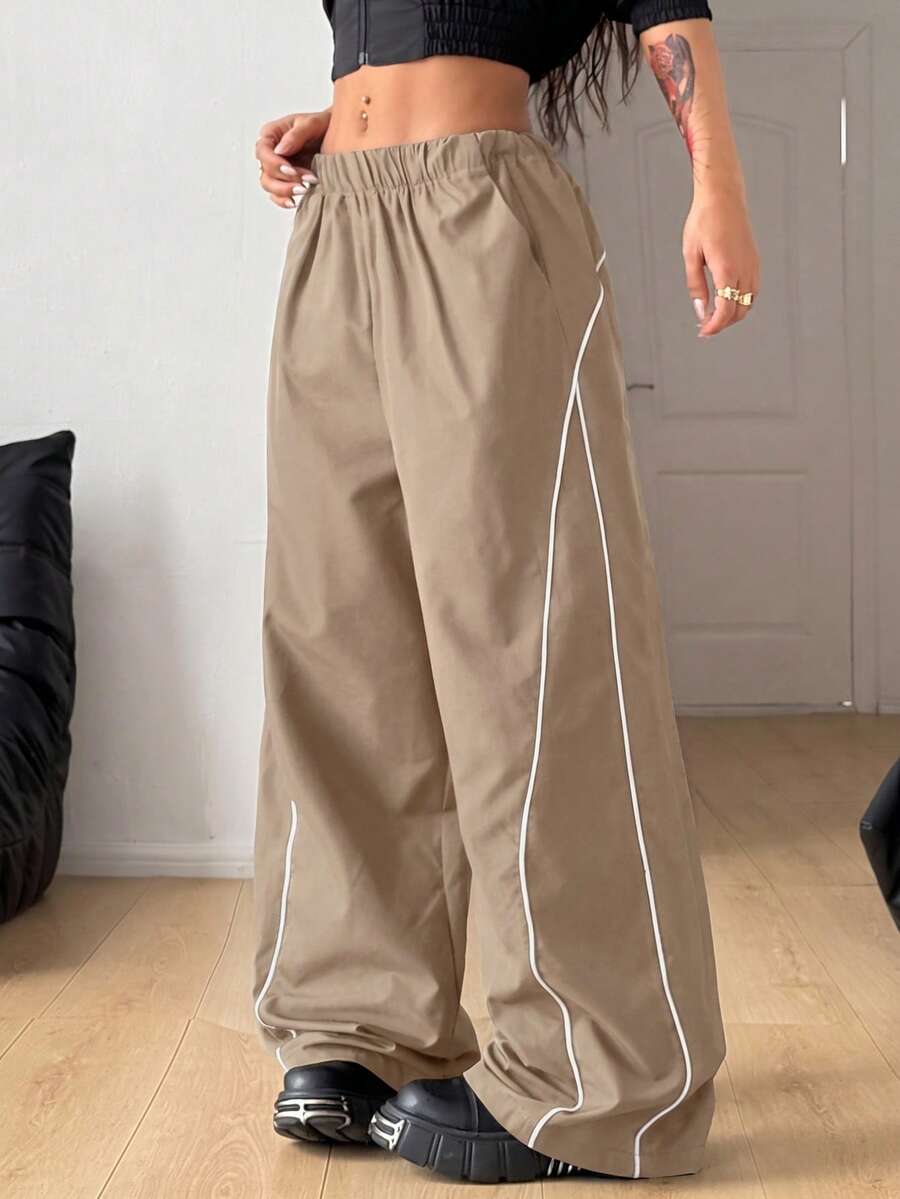 Plus size loose straight leg casual pants with elastic drawstring waist, contrast binding, and side pockets.