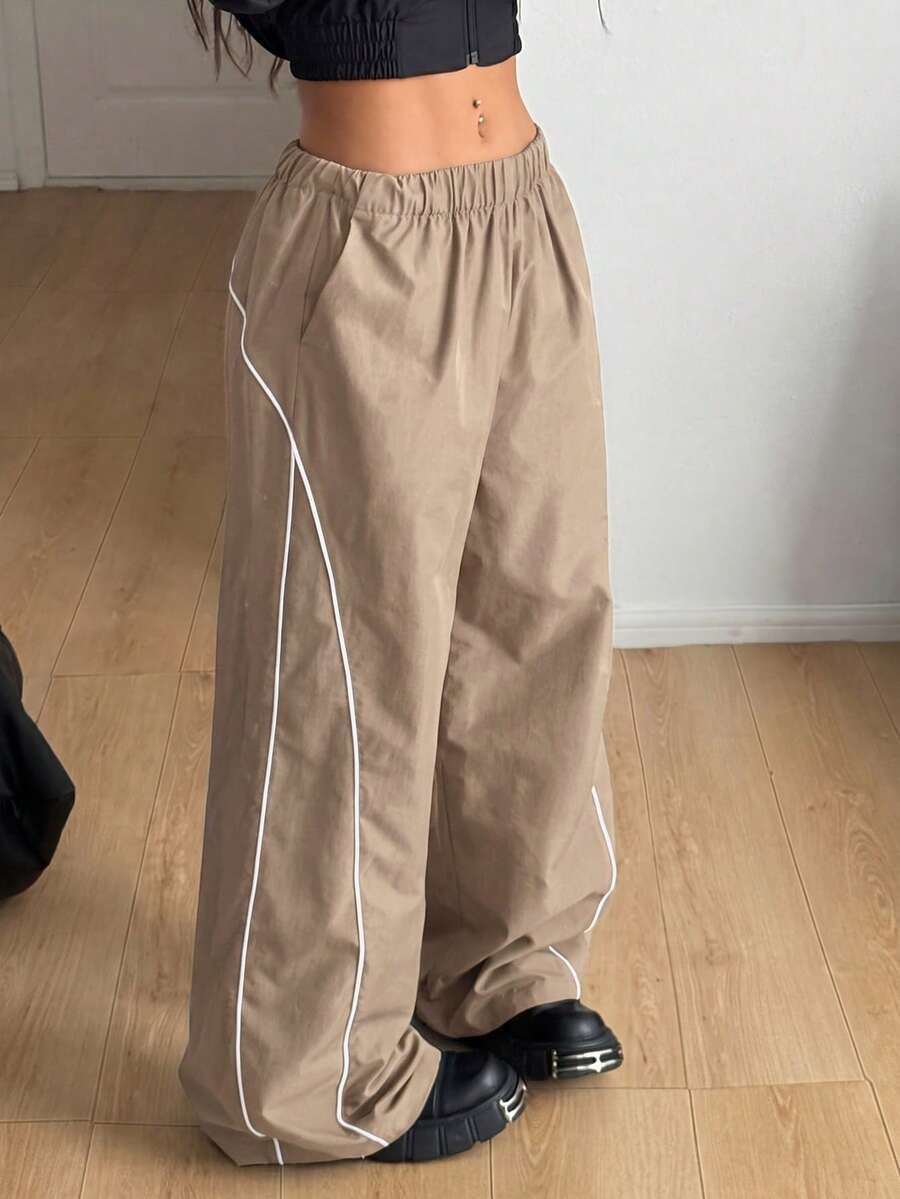 Plus size loose straight leg casual pants with elastic drawstring waist, contrast binding, and side pockets.