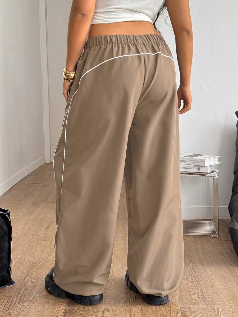 Plus size loose straight leg casual pants with elastic drawstring waist, contrast binding, and side pockets.