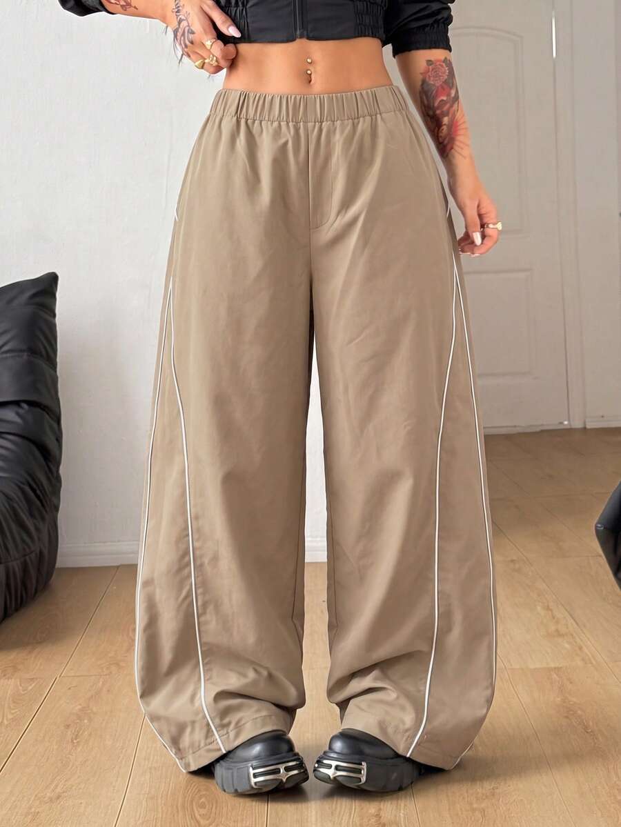 Plus size loose straight leg casual pants with elastic drawstring waist, contrast binding, and side pockets.