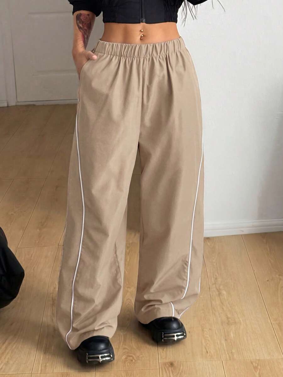 Plus size loose straight leg casual pants with elastic drawstring waist, contrast binding, and side pockets.