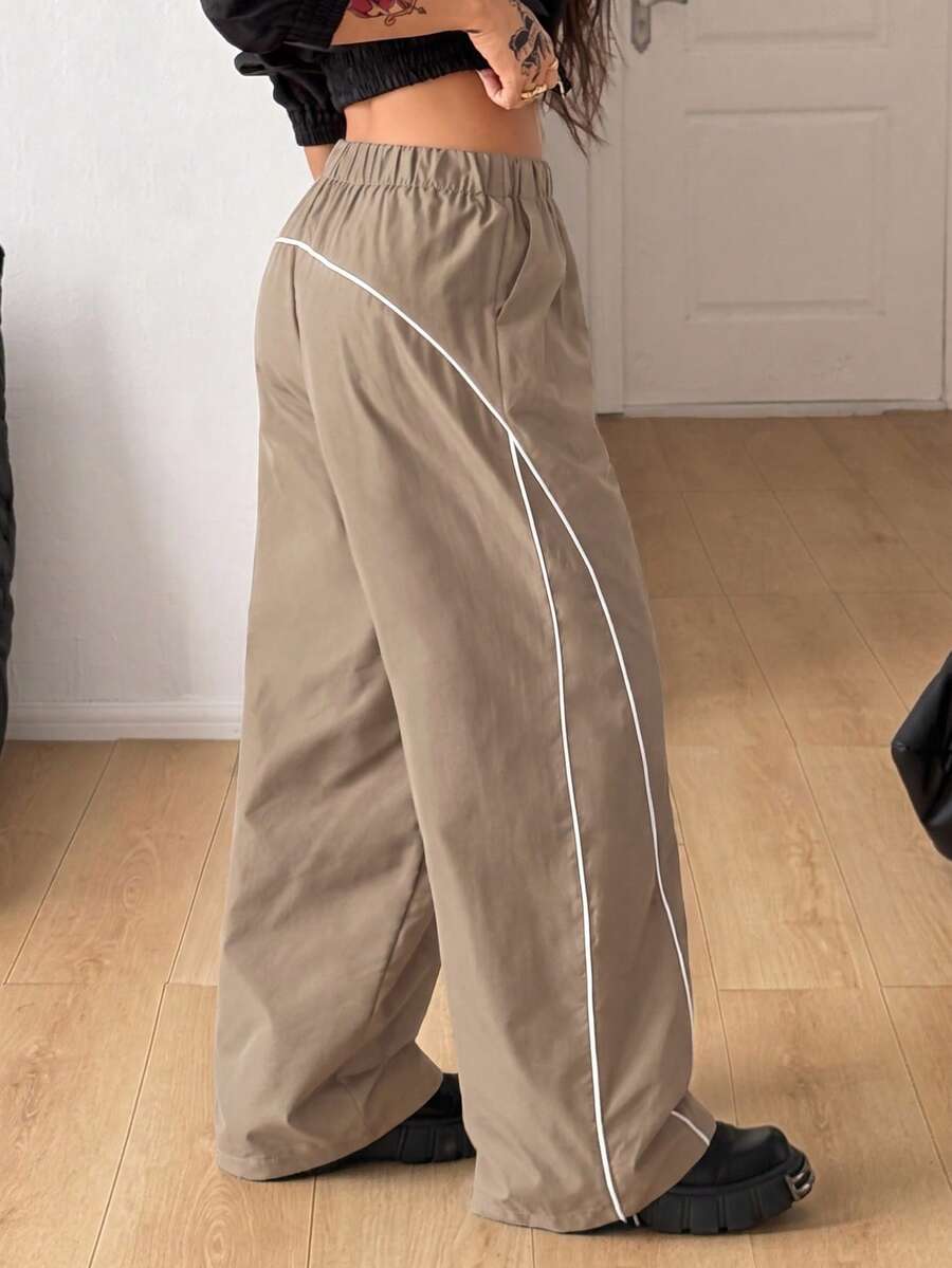Plus size loose straight leg casual pants with elastic drawstring waist, contrast binding, and side pockets.