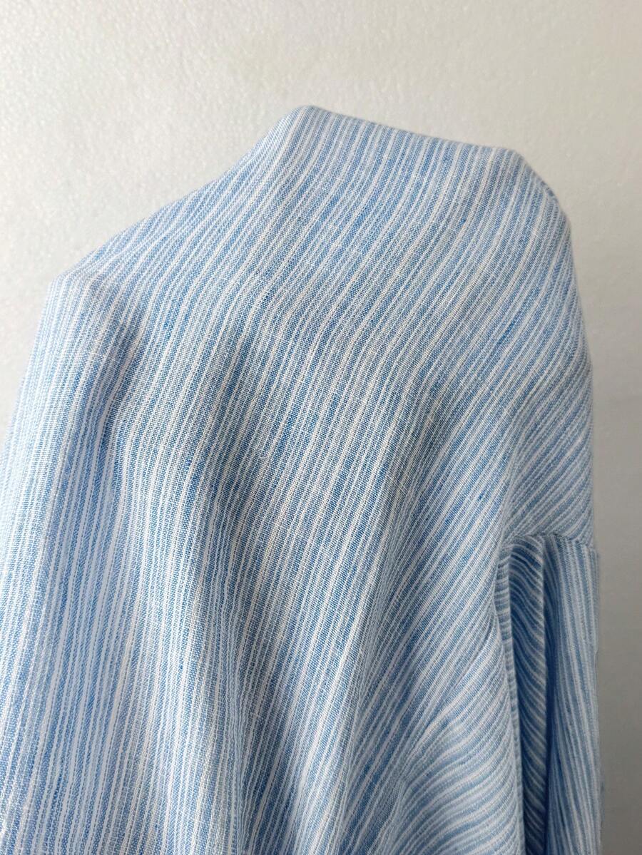 Women's loose straight leg cotton pants featuring a high waist with an adjustable drawstring knot and functional side pockets.