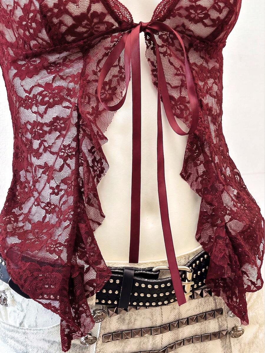 Women's semi-sheer deep V-neck top featuring cap sleeves, contrast lace trimming, and a lace-up front detail.
