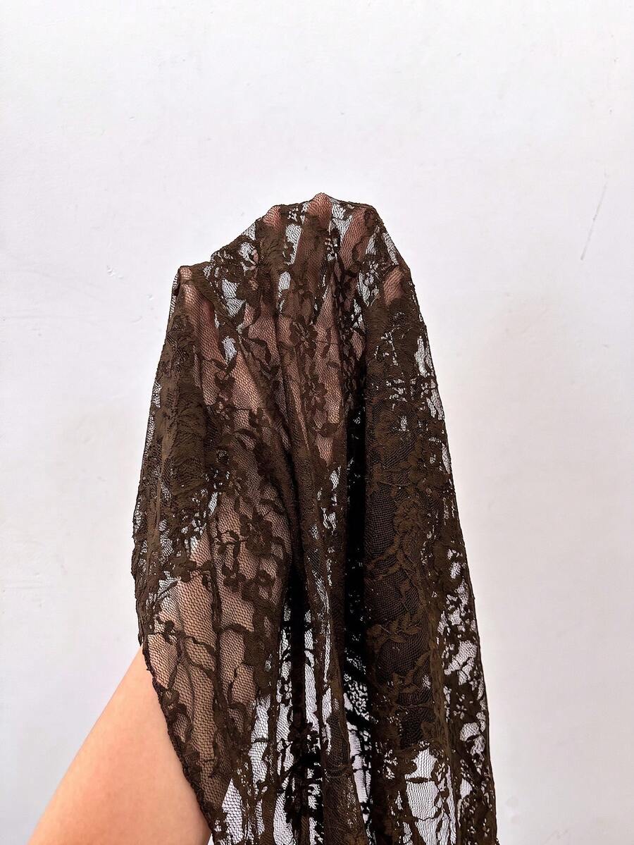 Women's semi-sheer deep V-neck top featuring cap sleeves, contrast lace trimming, and a lace-up front detail.
