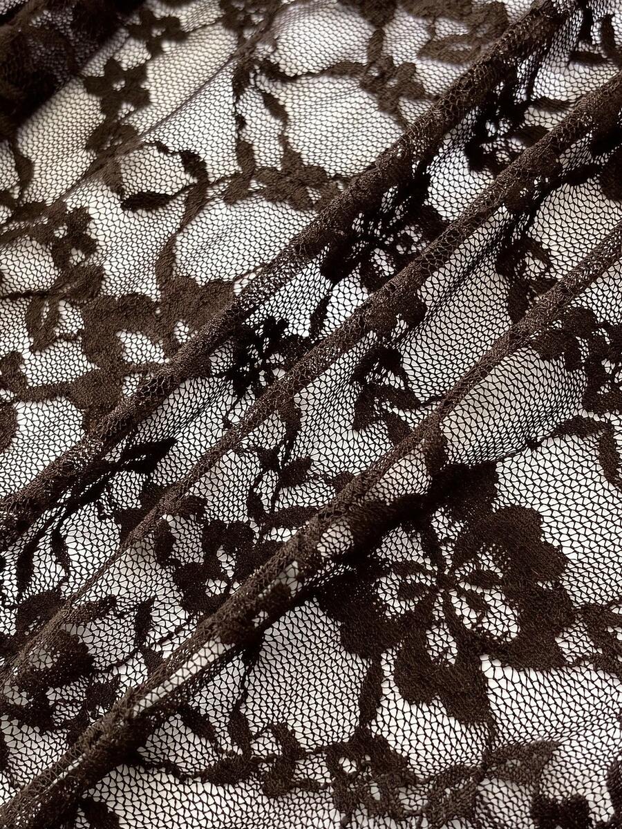 Women's semi-sheer deep V-neck top featuring cap sleeves, contrast lace trimming, and a lace-up front detail.