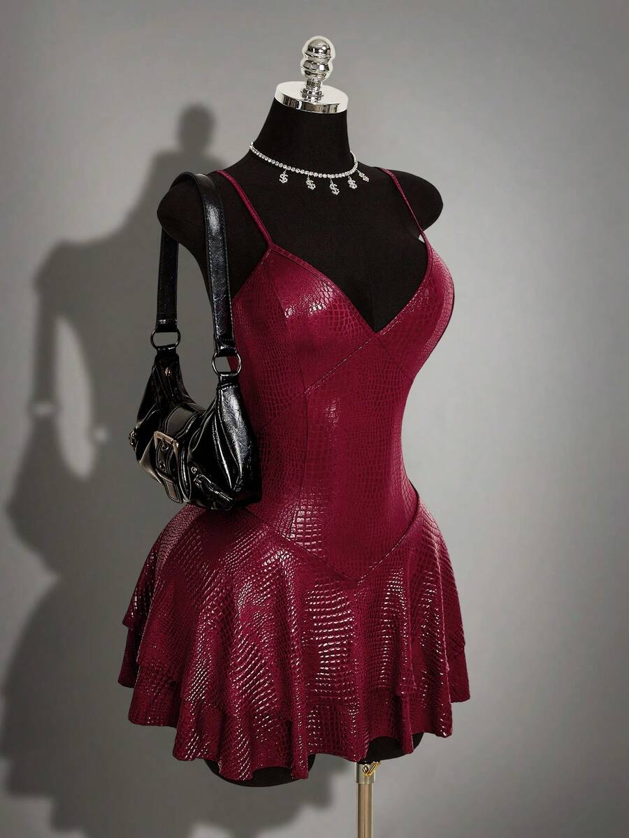 Women's Y2K PU leather mini dress with spaghetti straps, V-neckline, backless design, zipper closure, high waist, slim A-line fit, and layered tiered hem.