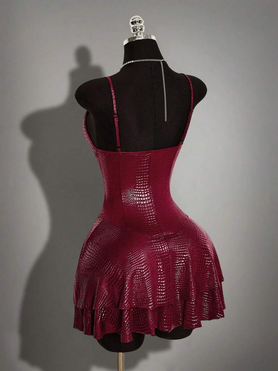 Women's Y2K PU leather mini dress with spaghetti straps, V-neckline, backless design, zipper closure, high waist, slim A-line fit, and layered tiered hem.