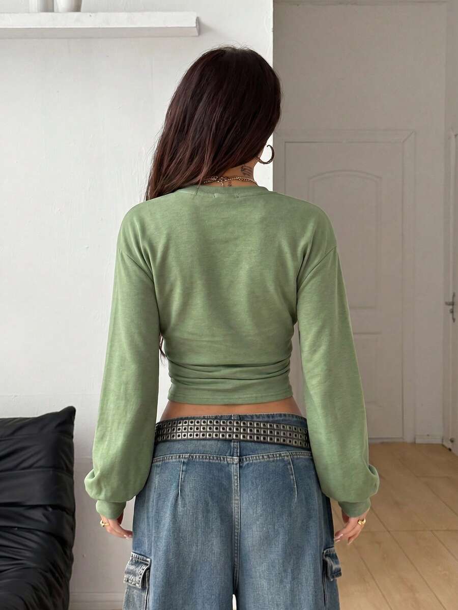Women's brown waist-cinching sweatshirt featuring a round neck, drop shoulder long sleeves, and rib-knit cuffs.