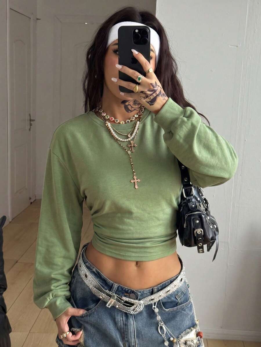 Women's brown waist-cinching sweatshirt featuring a round neck, drop shoulder long sleeves, and rib-knit cuffs.