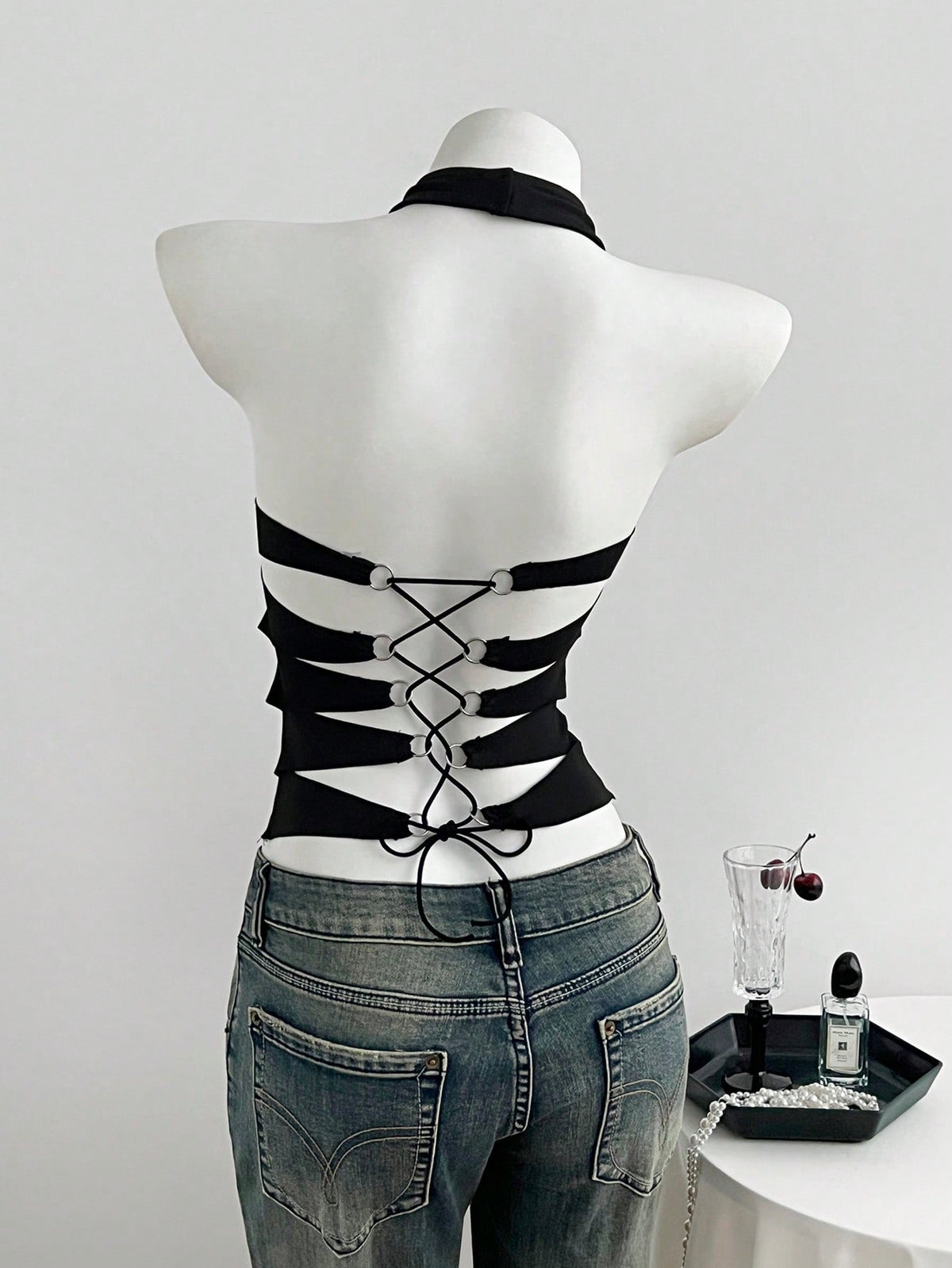 Black striped halter tank top with criss cross details and regular fit