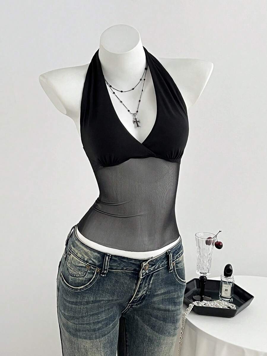 Black striped halter tank top with criss cross details and regular fit