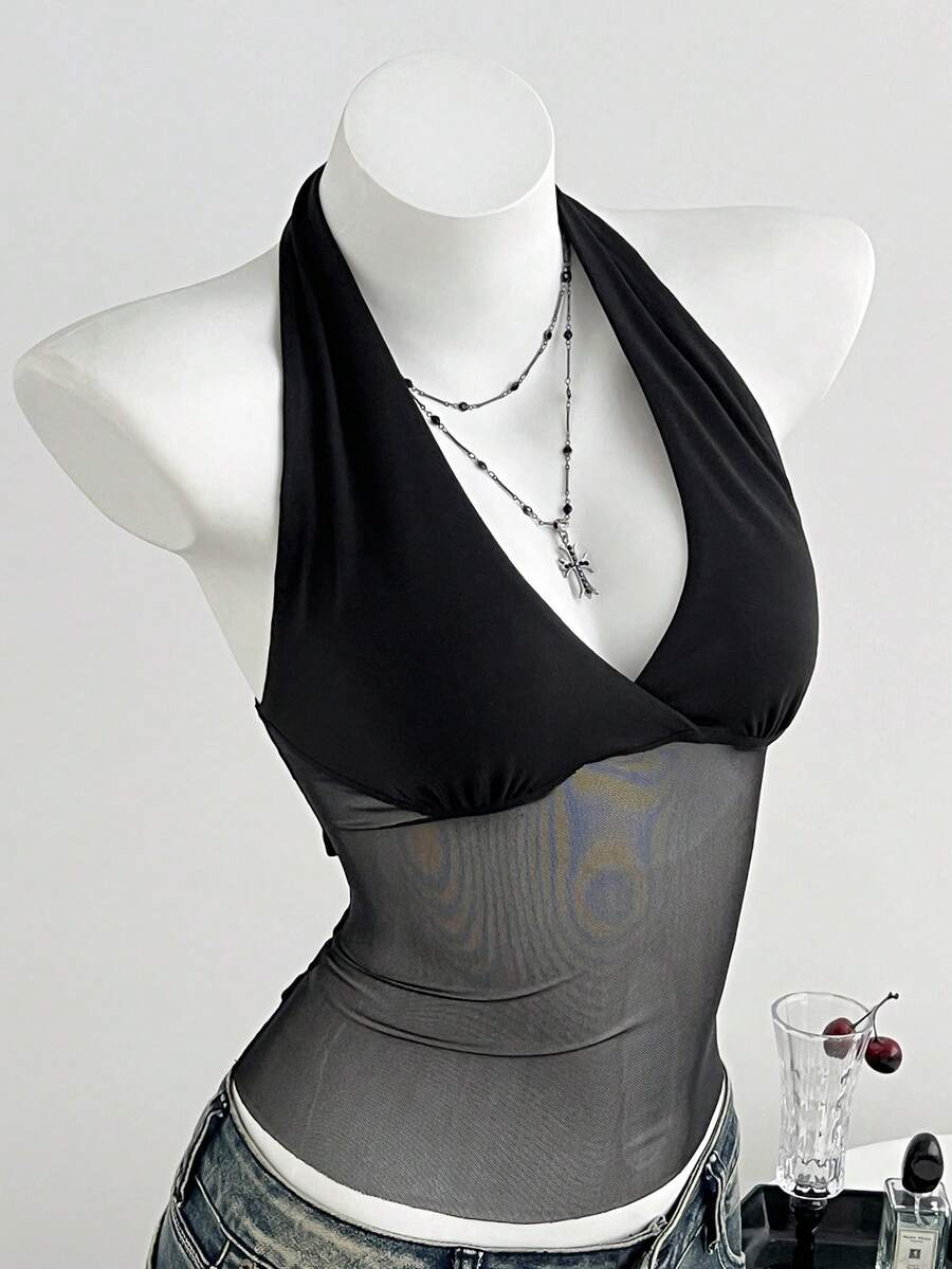 Black striped halter tank top with criss cross details and regular fit