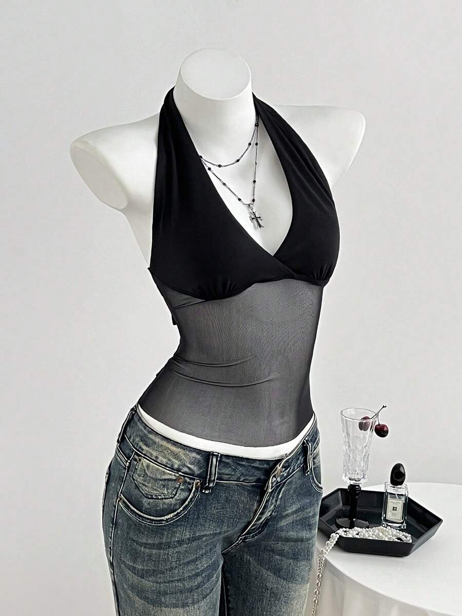 Black striped halter tank top with criss cross details and regular fit
