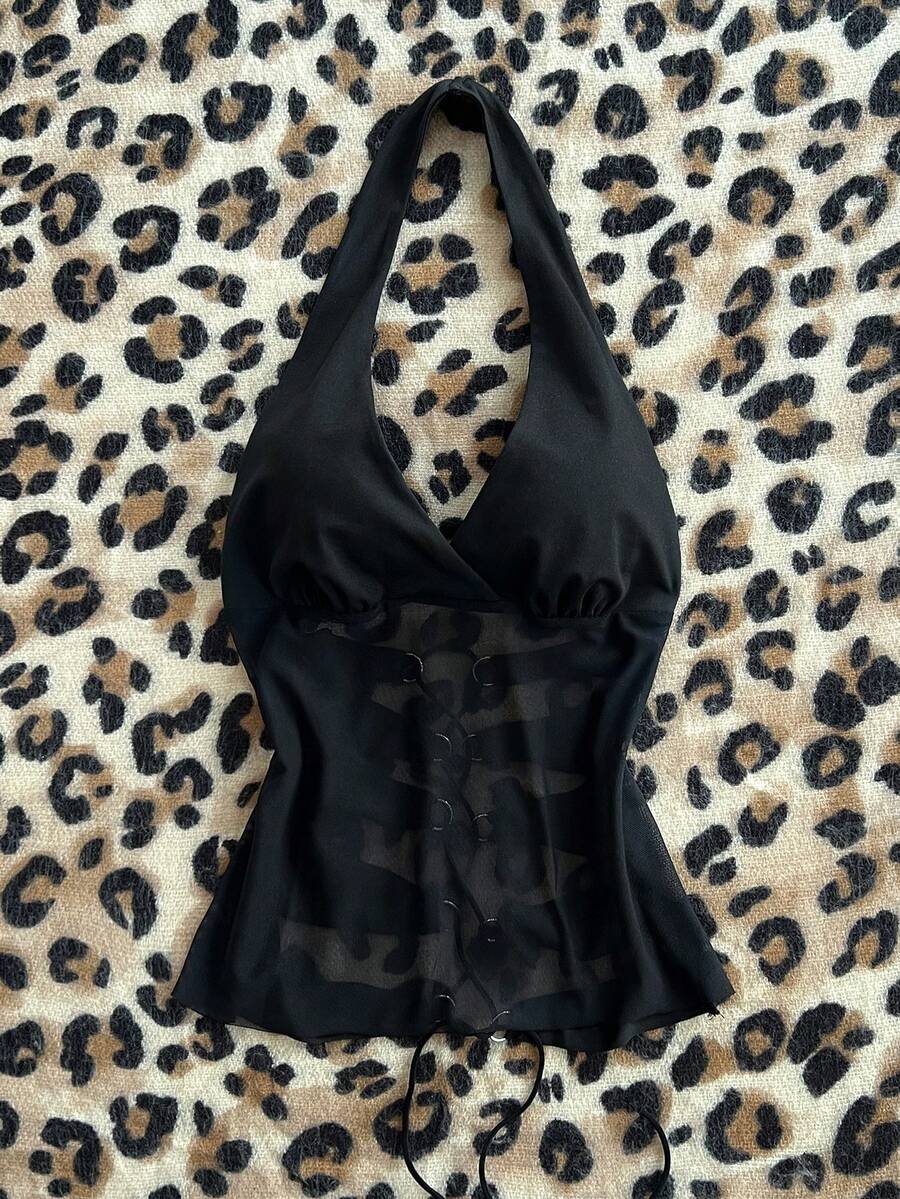 Black striped halter tank top with criss cross details and regular fit