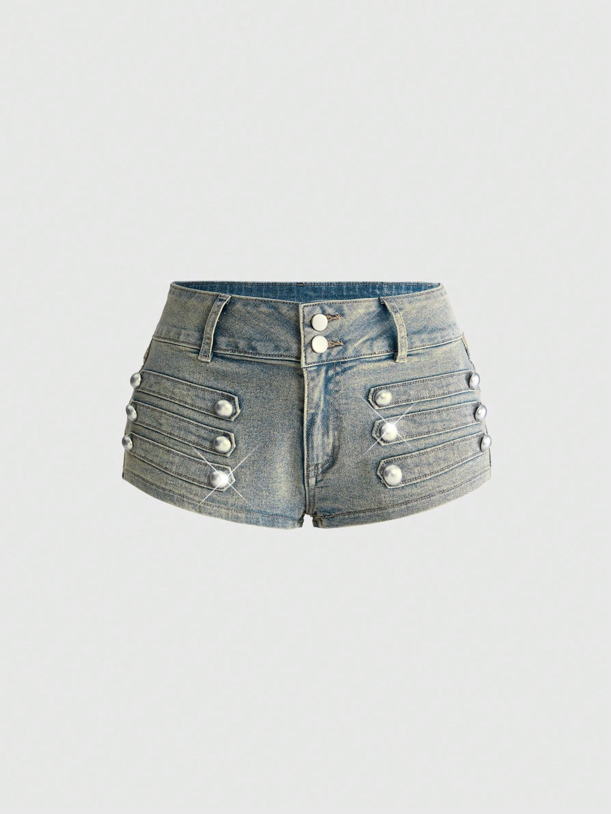 Front view of women's ultra low waist denim mini shorts with double metal button accents and zipper fly