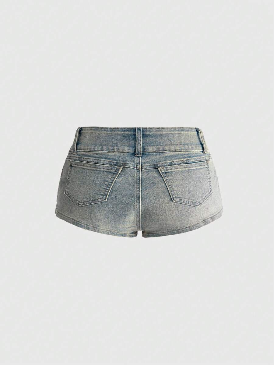 Front view of women's ultra low waist denim mini shorts with double metal button accents and zipper fly