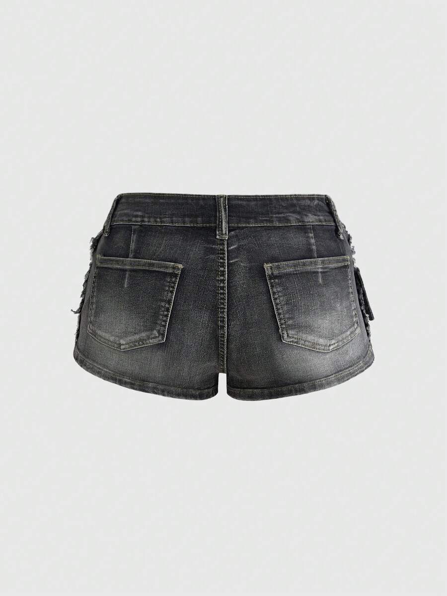 Black grunge punk low-waist mini shorts with studded details and zipper fly closure