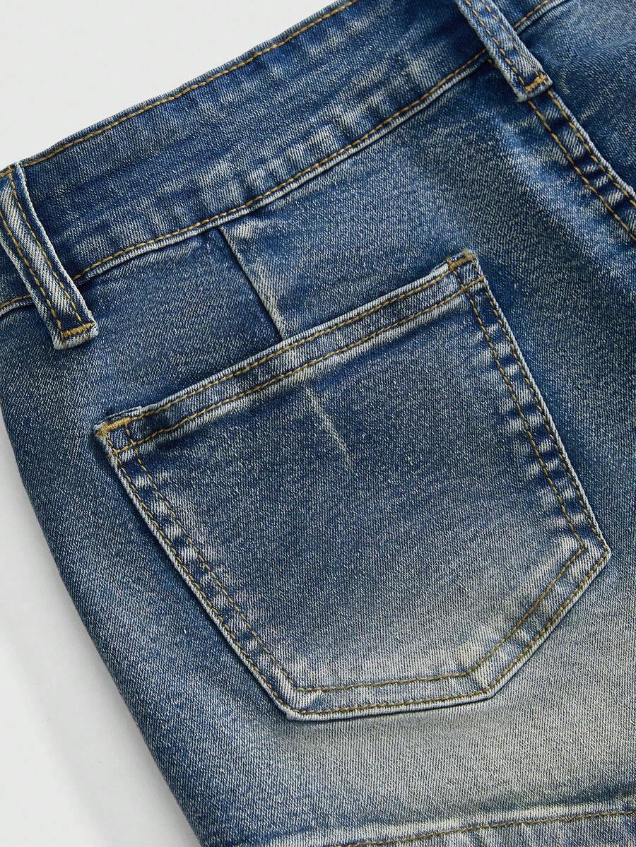 Black grunge punk low-waist mini shorts with studded details and zipper fly closure