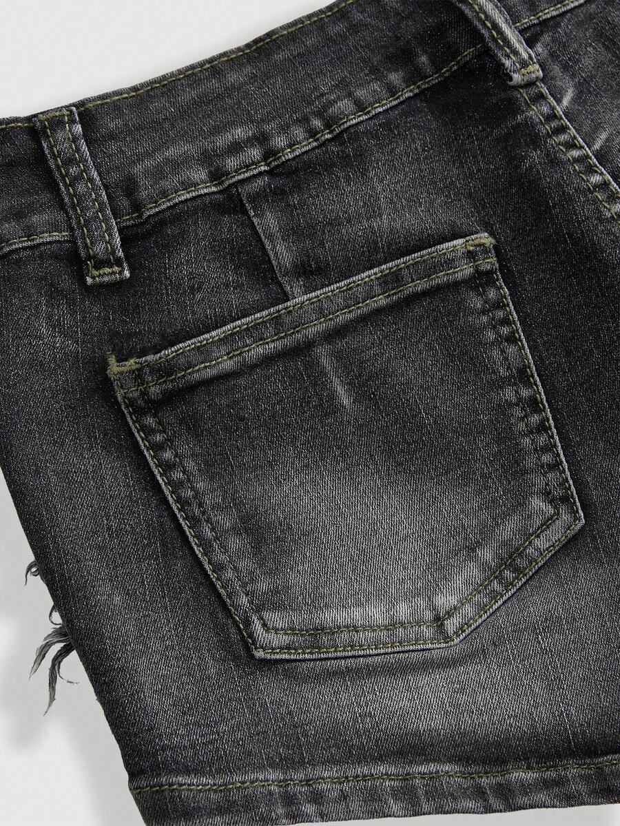 Black grunge punk low-waist mini shorts with studded details and zipper fly closure
