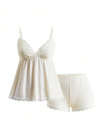 Ribbed lace camisole and shorts pajama set with spaghetti straps, bow detail, and contrast lace trim