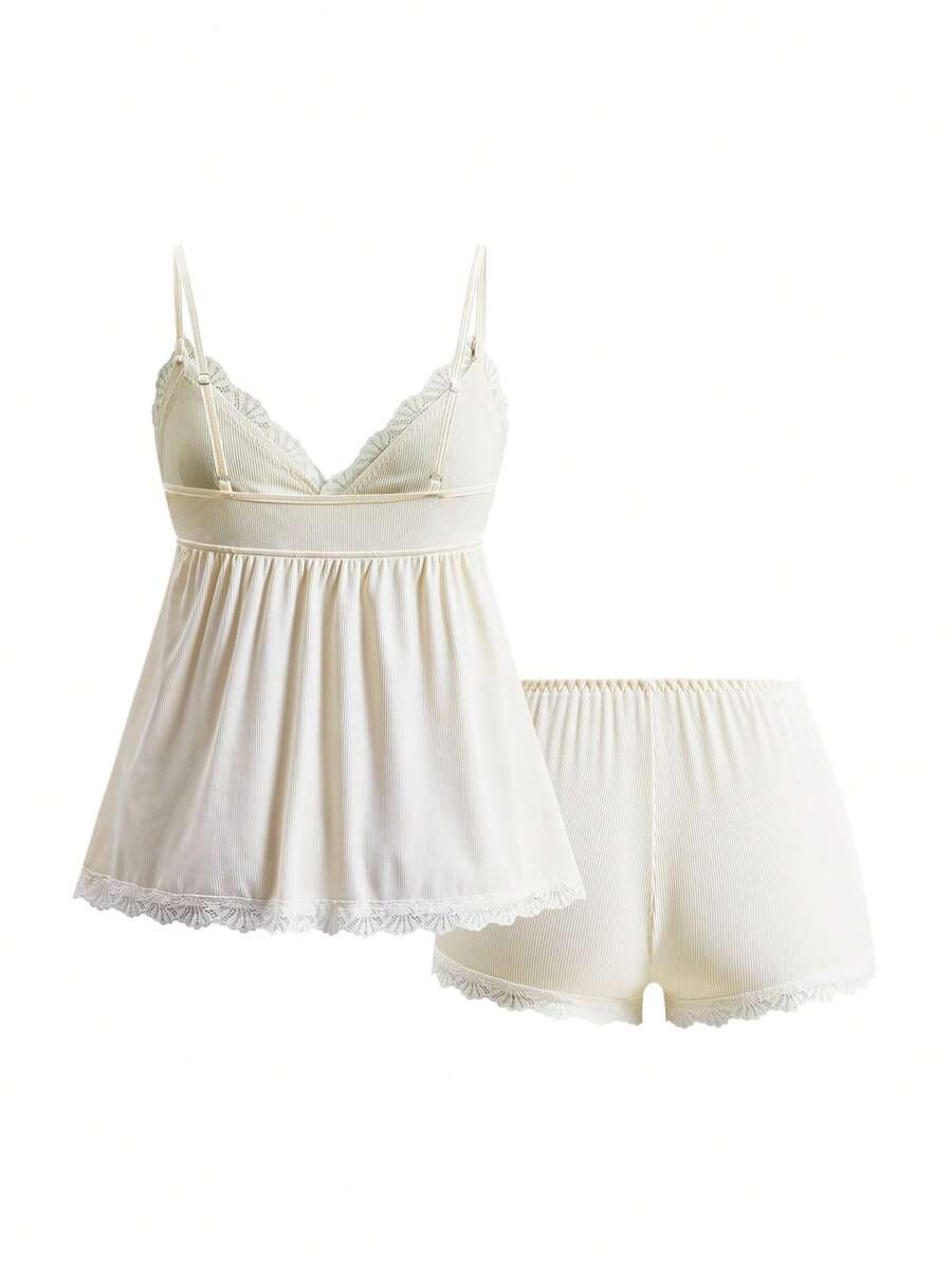 Ribbed lace camisole and shorts pajama set with spaghetti straps, bow detail, and contrast lace trim
