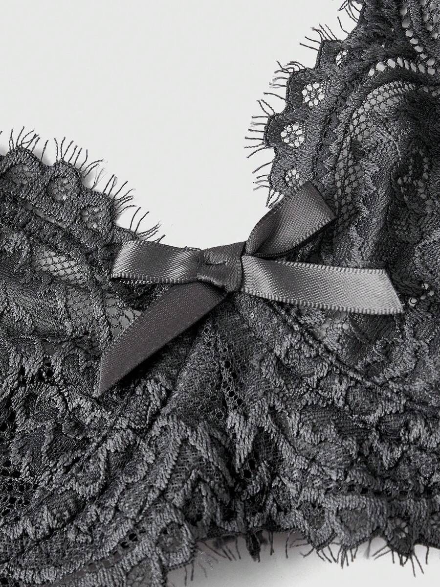 Sheer floral lace underwire triangle bra for women featuring adjustable straps and plunge cup design.
