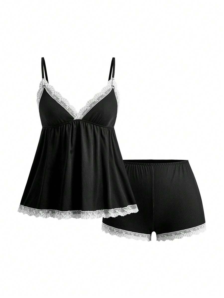Ribbed lace camisole and shorts pajama set with spaghetti straps, bow detail, and contrast lace trim