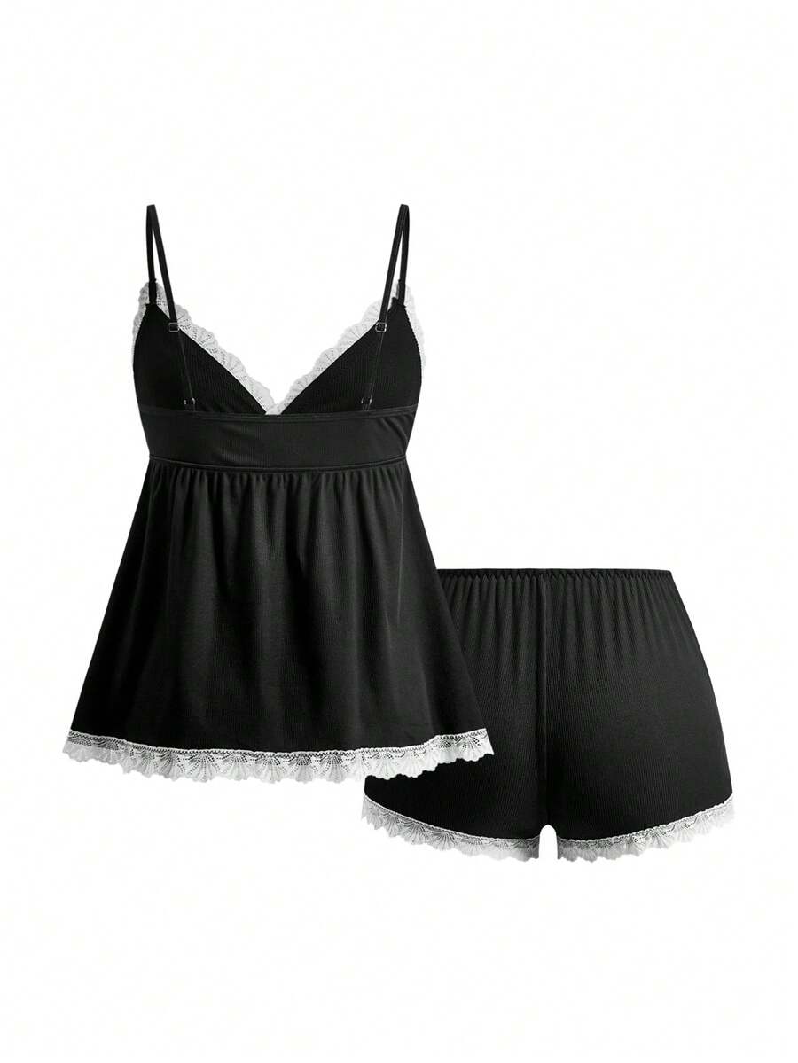 Ribbed lace camisole and shorts pajama set with spaghetti straps, bow detail, and contrast lace trim