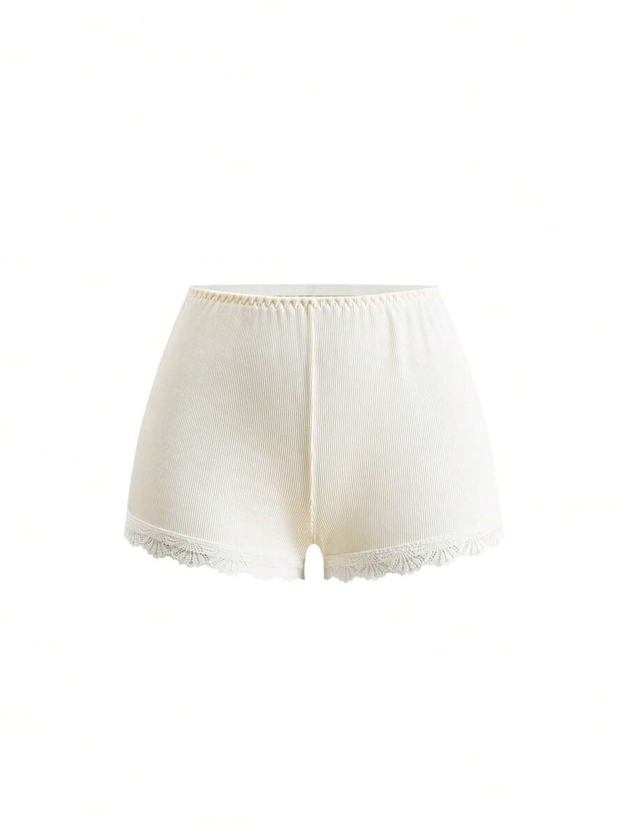 Ribbed lace camisole and shorts pajama set with spaghetti straps, bow detail, and contrast lace trim