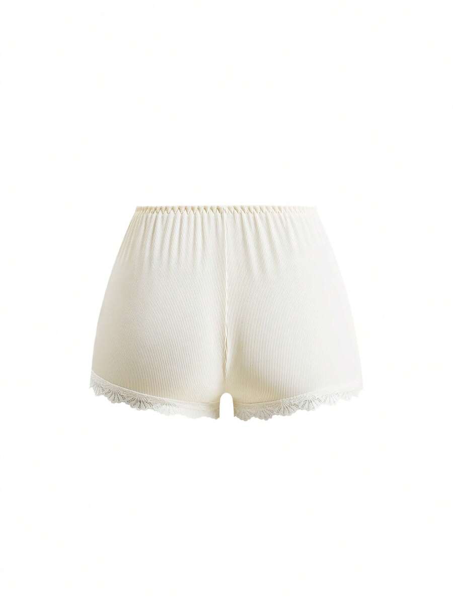 Ribbed lace camisole and shorts pajama set with spaghetti straps, bow detail, and contrast lace trim