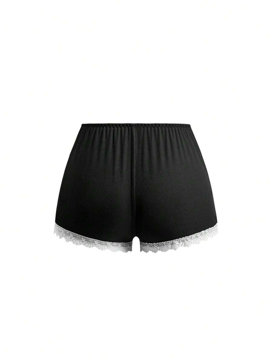 Ribbed lace camisole and shorts pajama set with spaghetti straps, bow detail, and contrast lace trim