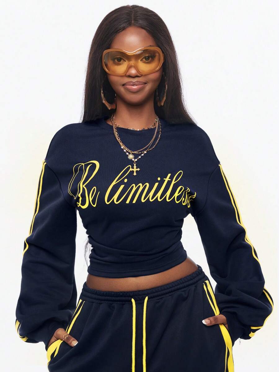 Women's casual black long sleeve knitted pullover sweatshirt featuring a round neck and cinched waist design.
