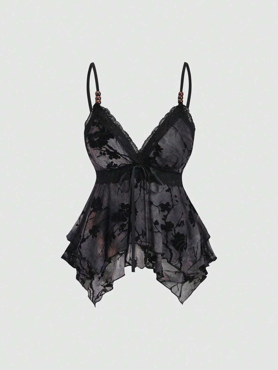 Women's black spaghetti strap tank top featuring contrast lace details, asymmetric ruffle hem, and slim fit design.