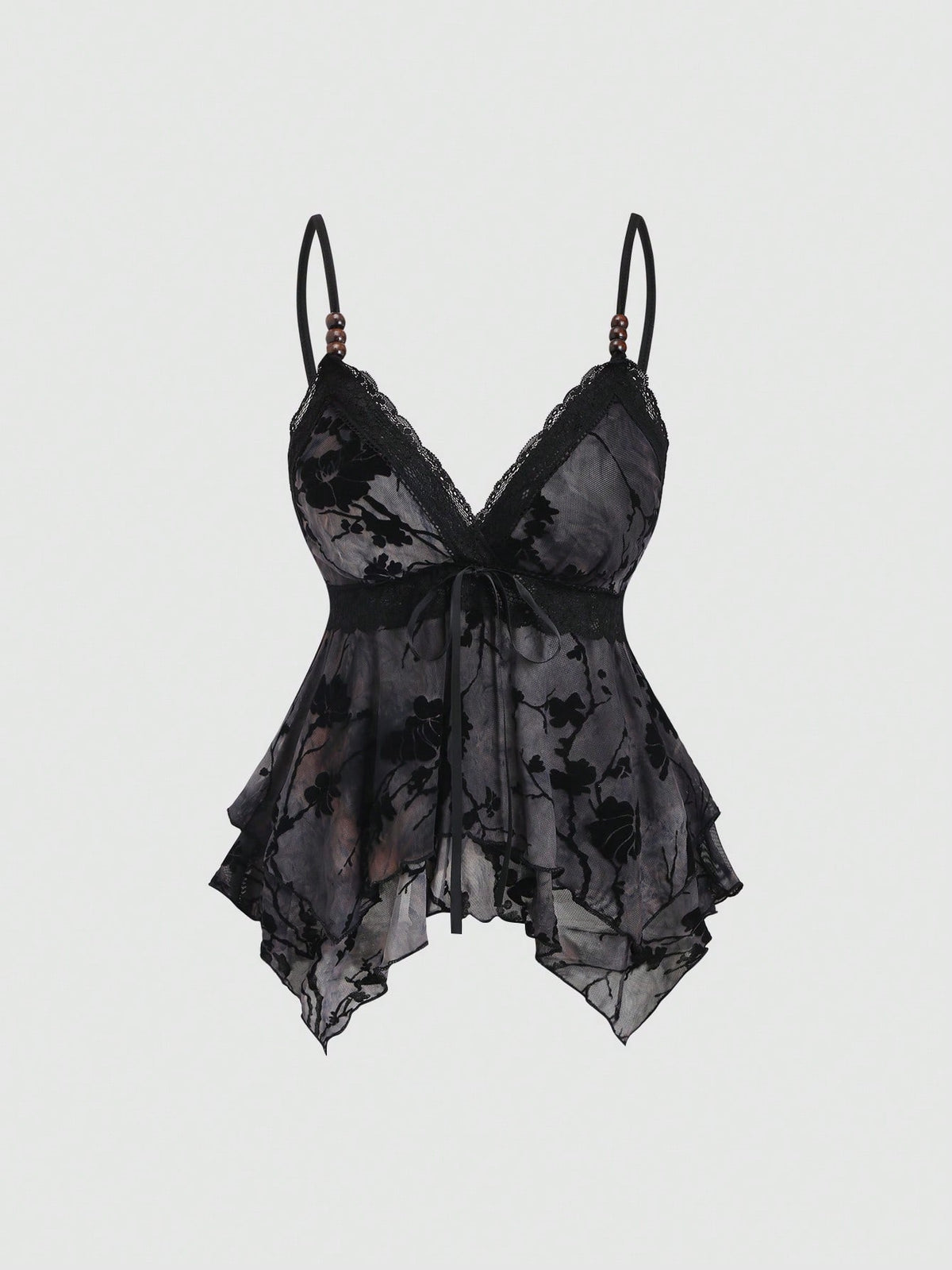 Women's black spaghetti strap tank top featuring contrast lace details, asymmetric ruffle hem, and slim fit design.